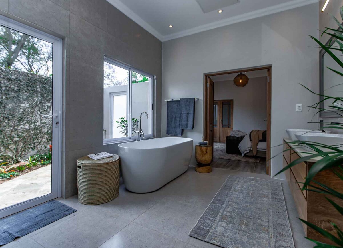 Luxurious bathroom in a suite at White River Manor, featuring modern fixtures, elegant decor, and a spacious layout designed for comfort and relaxation