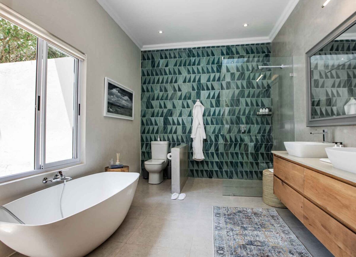 Luxurious bathroom in a suite at White River Manor, featuring modern fixtures, elegant decor, and a spacious layout designed for comfort and relaxation