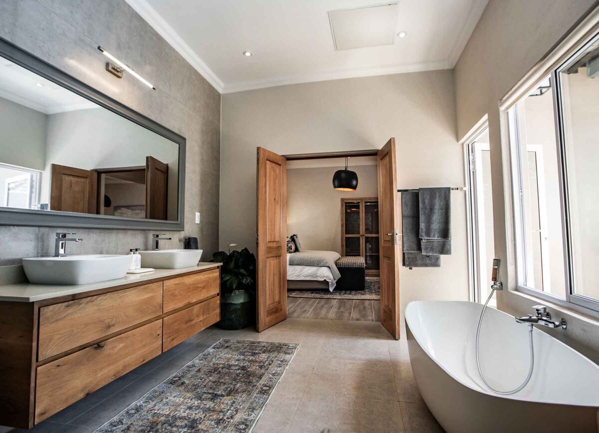 Luxurious bathroom in a suite at White River Manor, featuring modern fixtures, elegant decor, and a spacious layout designed for comfort and relaxation