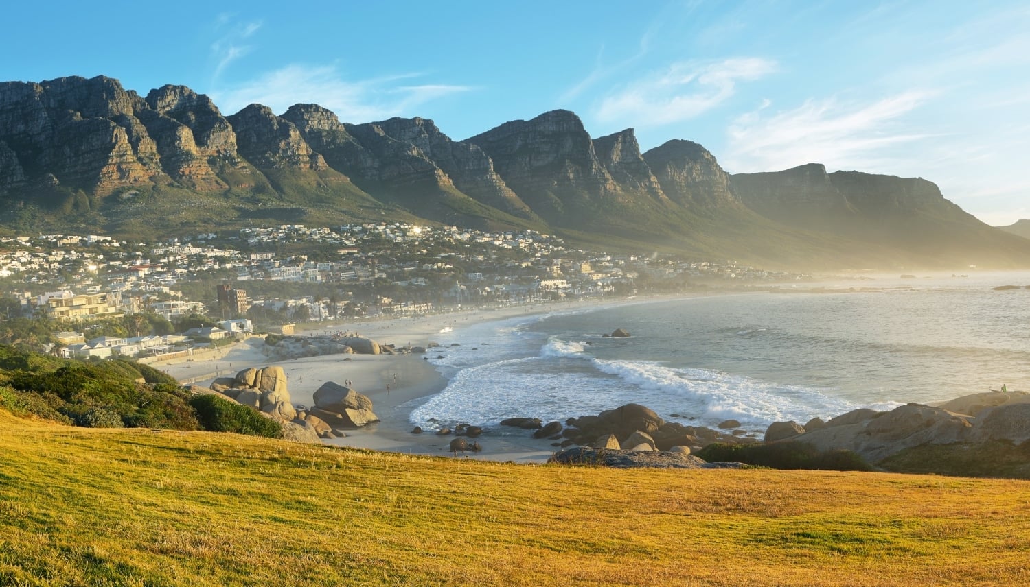 Camps Bay Beach in Cape Town, South Africa, with the Twelve Apostles in the backgroun