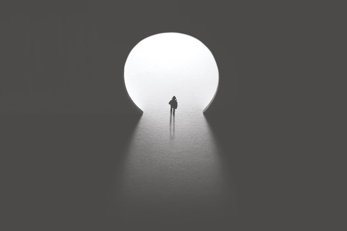 man walking toward keyhole light door