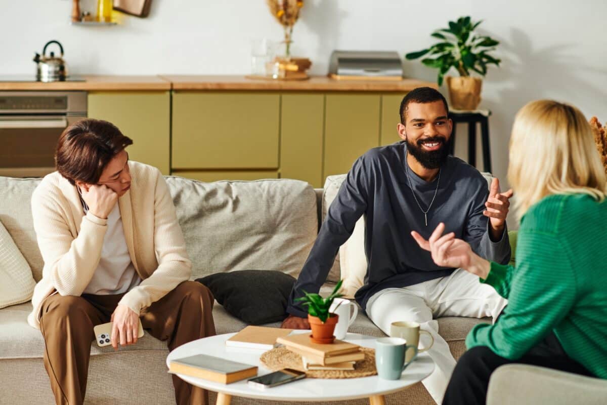 Engaging conversation among young men in a cozy home book club setting
