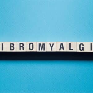 Fibromyalgia word concept on cubes.