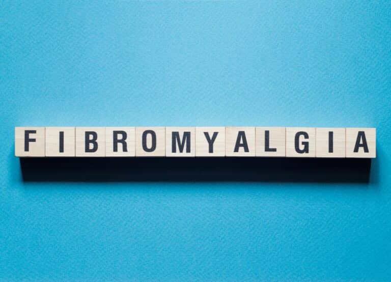 Fibromyalgia word concept on cubes.