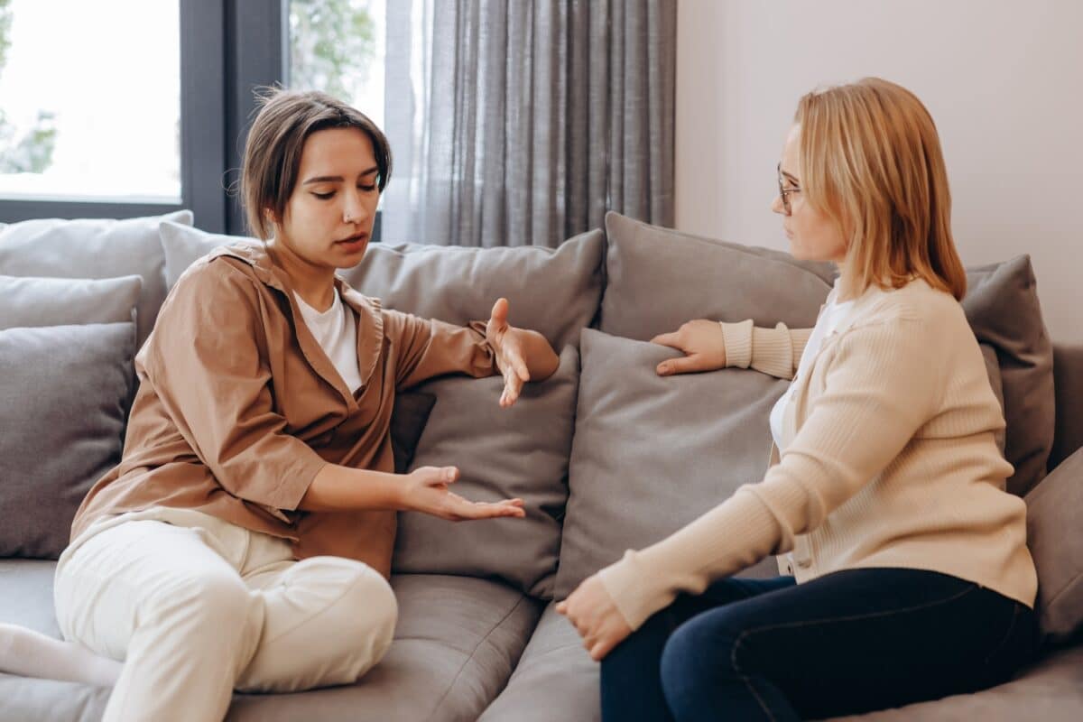 A young woman in a consultation with a professional psychologist listens to advice on improving behavior in life. The modern millennial woman is developing mindfulness and psychological health