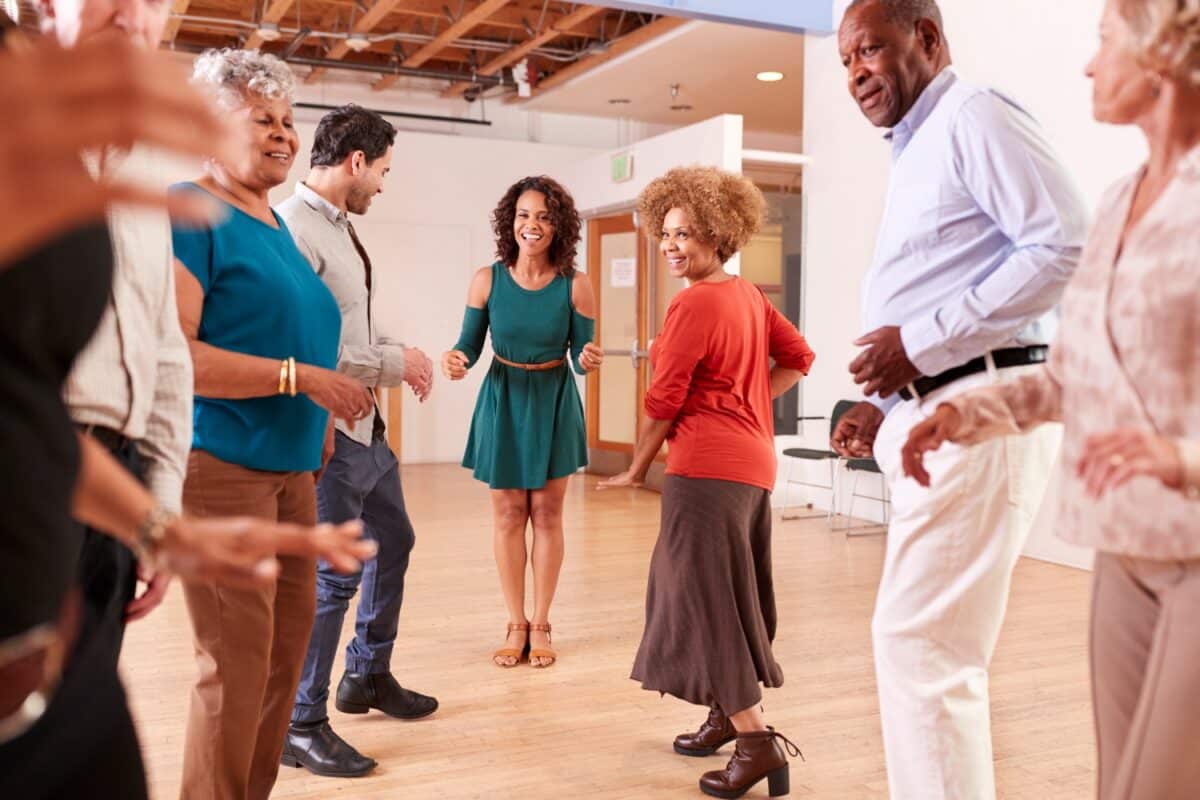 People Attending Dance Class In Community Center