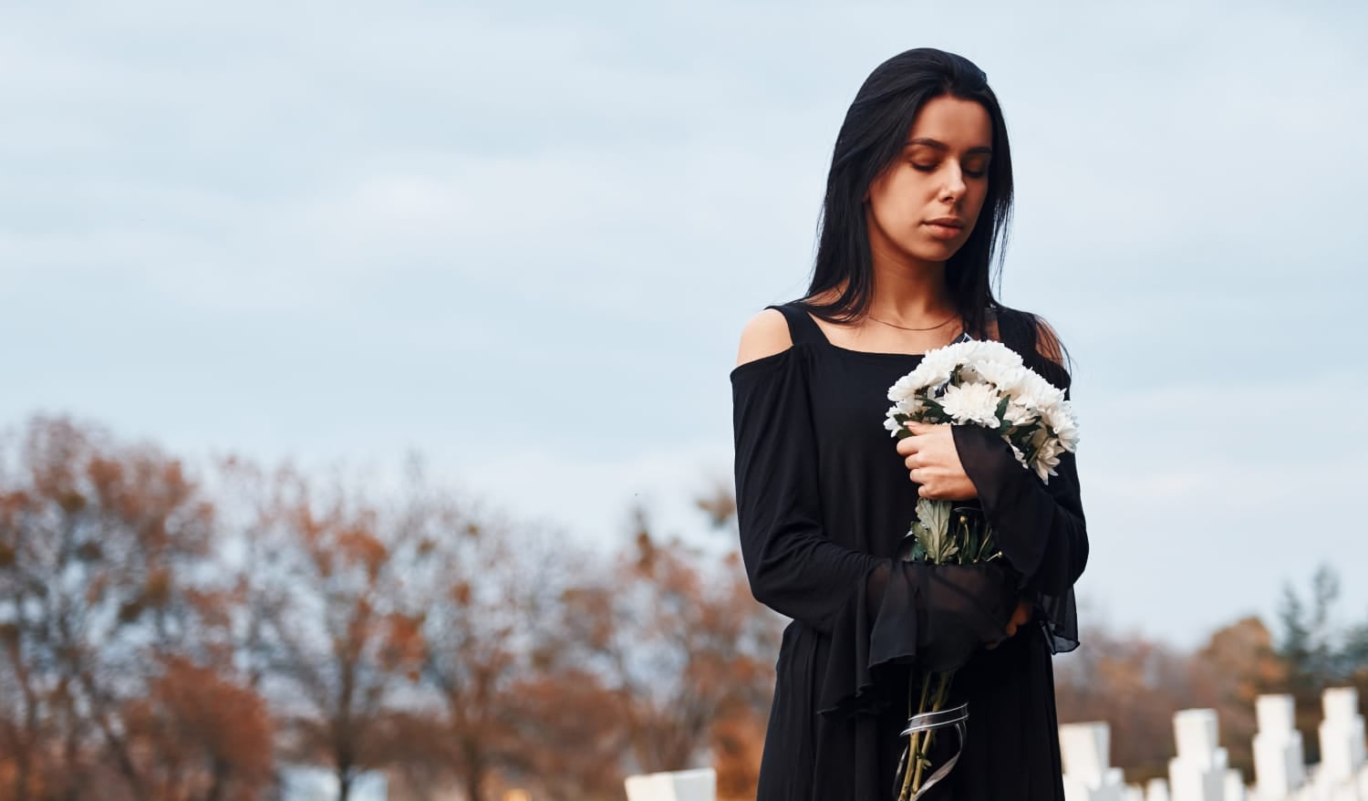 Young woman in black clothes looking sad, grieving concept