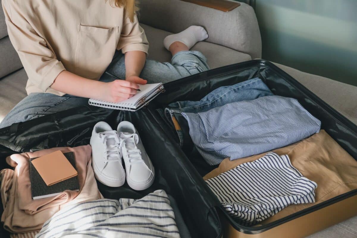 girl collects a suitcase for travel