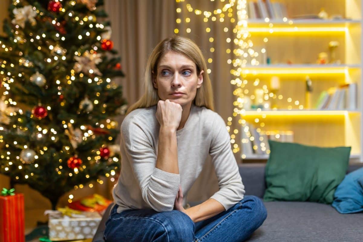 sad woman alone at home for Christmas and New Year